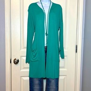NWOT. Ladies teal green duster/ cardigan. Thigh length. 2 pocket detail.